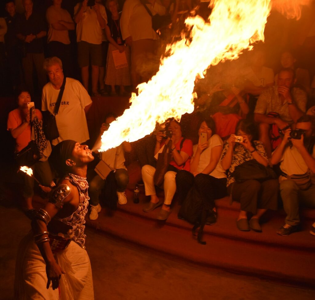 people standing near bonfire during nighttime